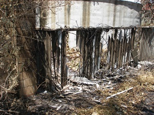 Fire damaged asbestos fence Fire damaged asbestos fence