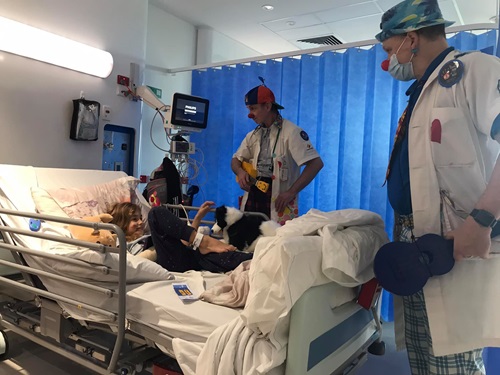 Ayla in bed at PCH with the Clown Doctors