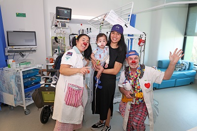 Dr Dopey and Dr Big with a young patient at his mother at PCH.
