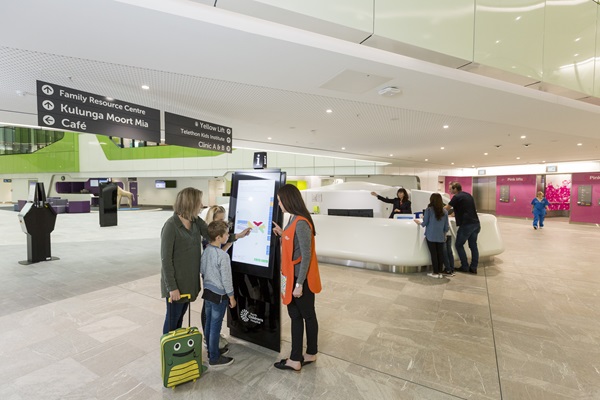Family at the Wayfinding kiosk at PCH