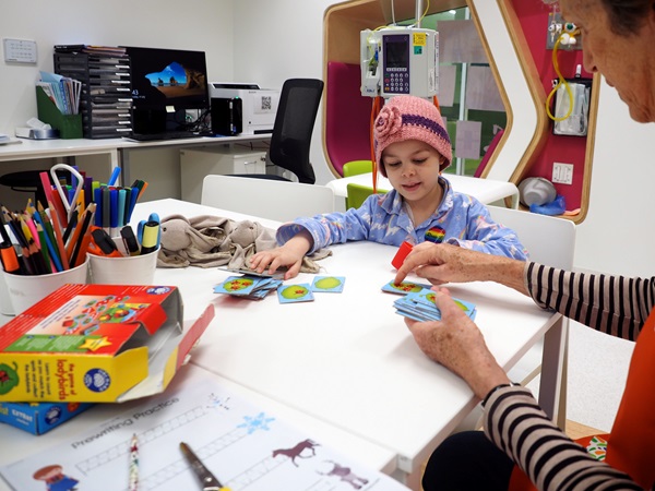 Girl playing cards at PCH