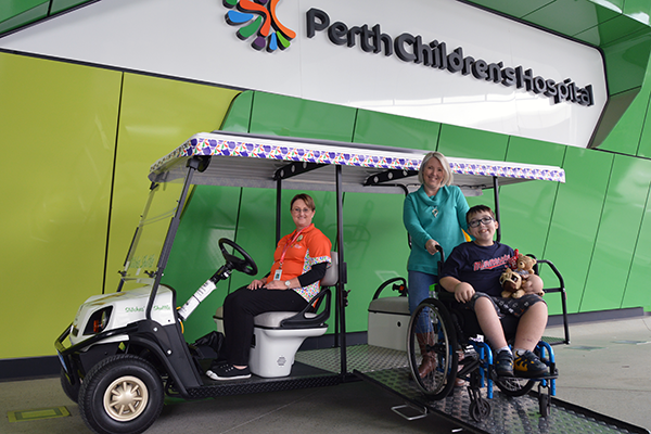 Picture of the Stitches Shuttle with a volunteer driver and a patient and parent