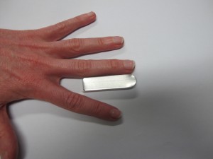 Zimmer splint (aluminium with foam back) cut to the appropriate length from finger tip to just distal to the PIP joint. 
