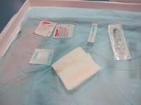 Sterile dressing pack with equipment for suprapubic aspiration. 